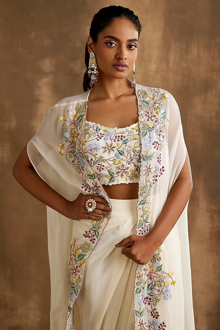 White draped skirt with embroidered crop top & cape