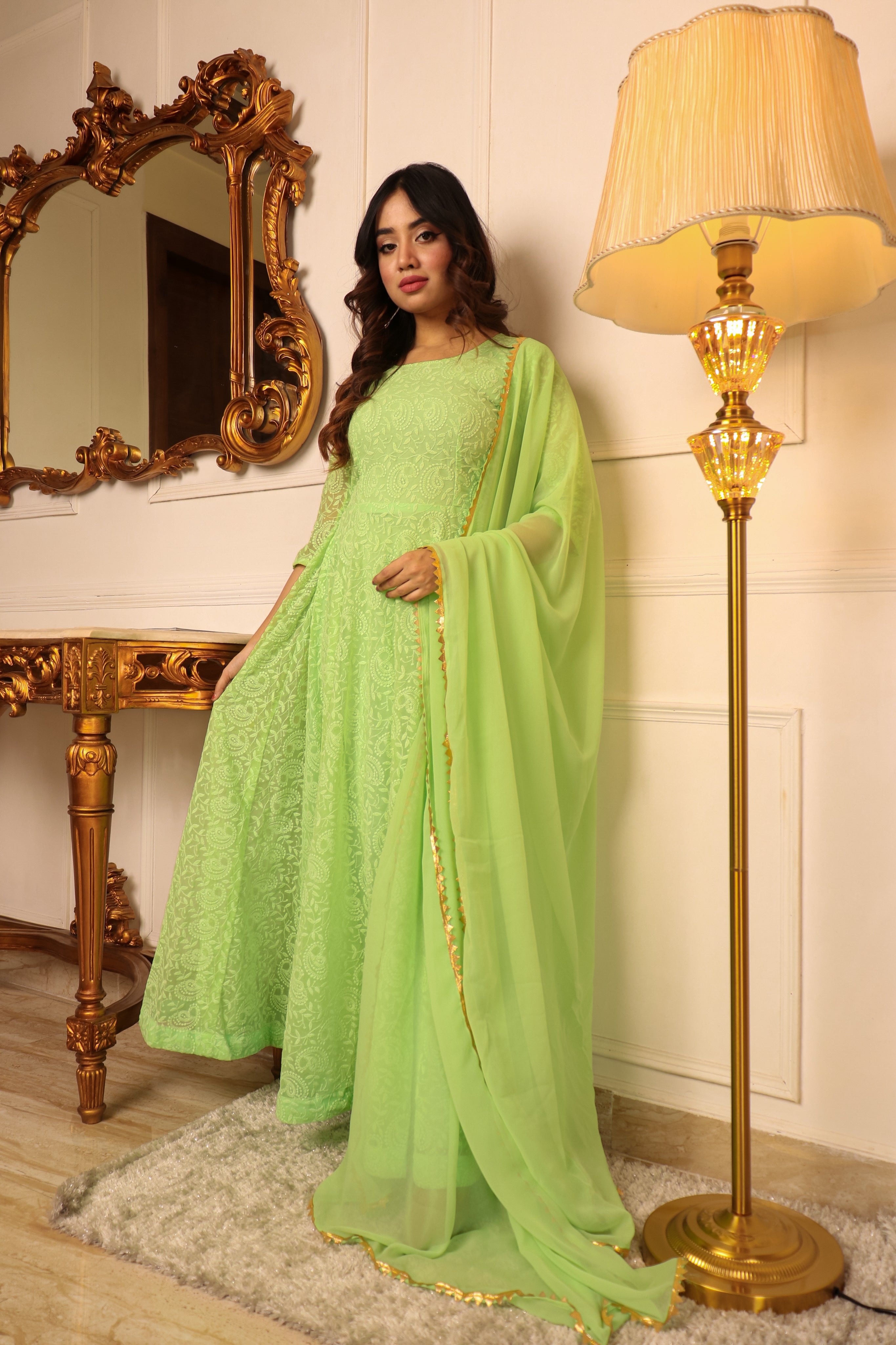 ELEGANT PISTA GREEN COLORED CHIKANKARI FLOOR TOUCH GOWN