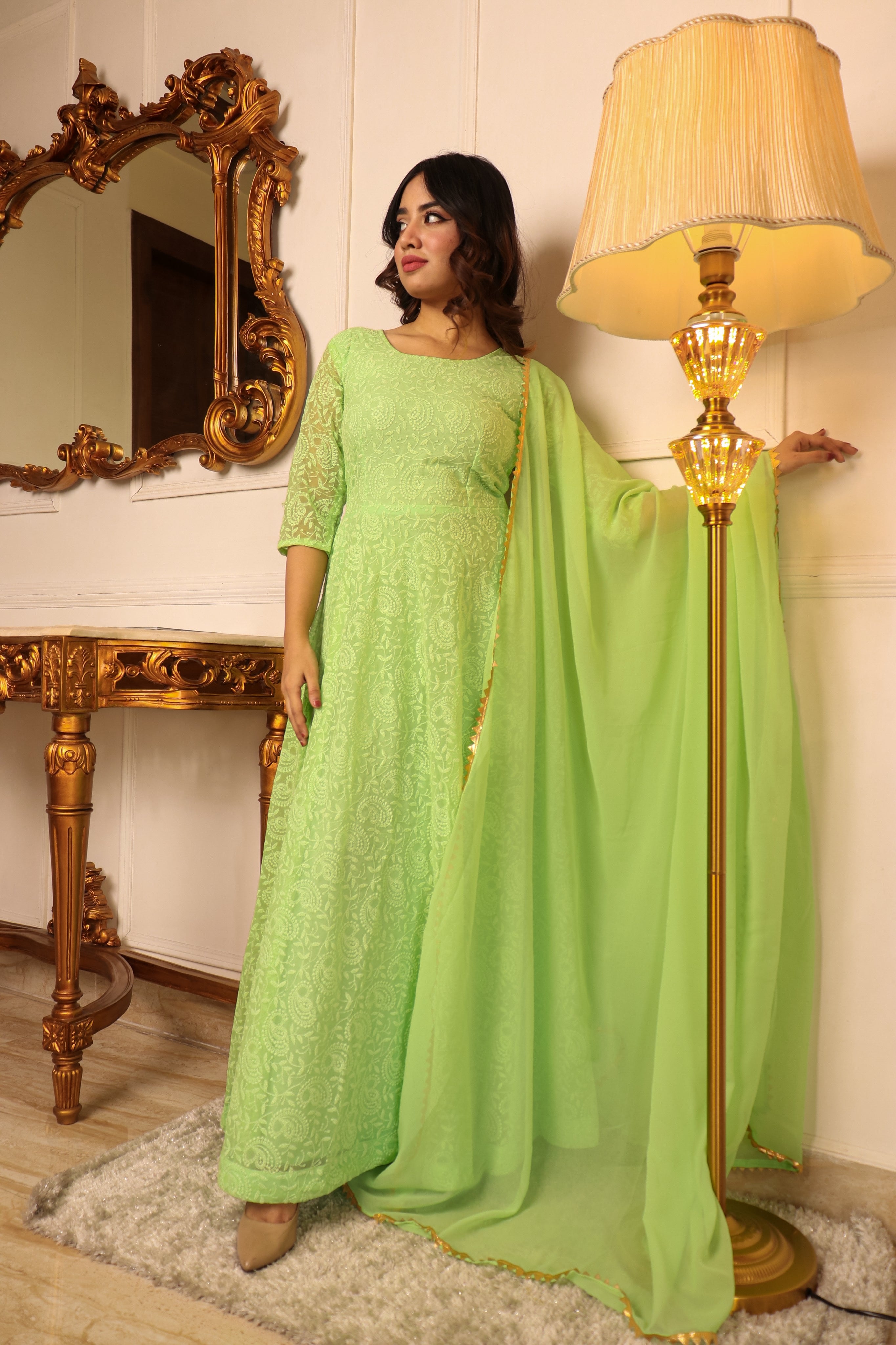 ELEGANT PISTA GREEN COLORED CHIKANKARI FLOOR TOUCH GOWN