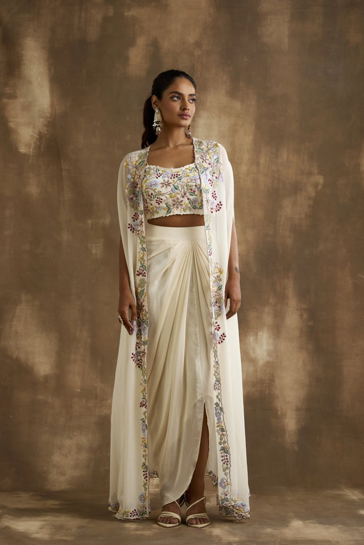 White draped skirt with embroidered crop top & cape