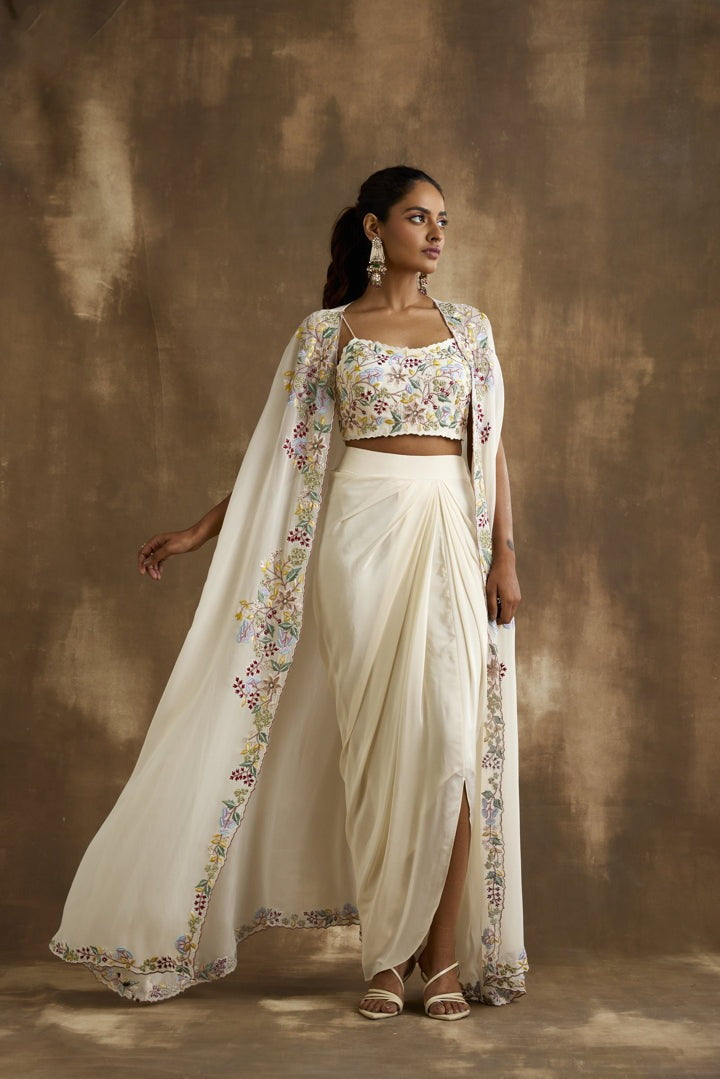 White draped skirt with embroidered crop top & cape